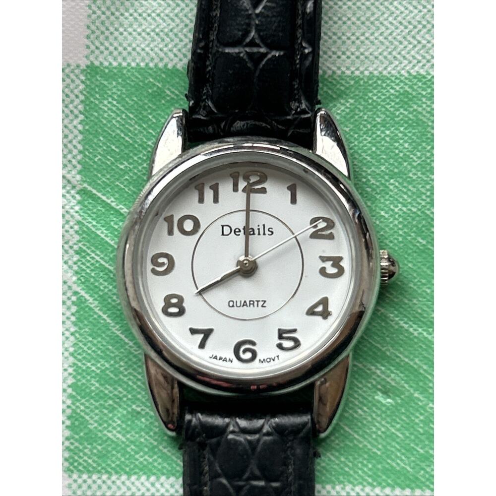 Details Silver Tone Black Band Women’s Quartz Watch